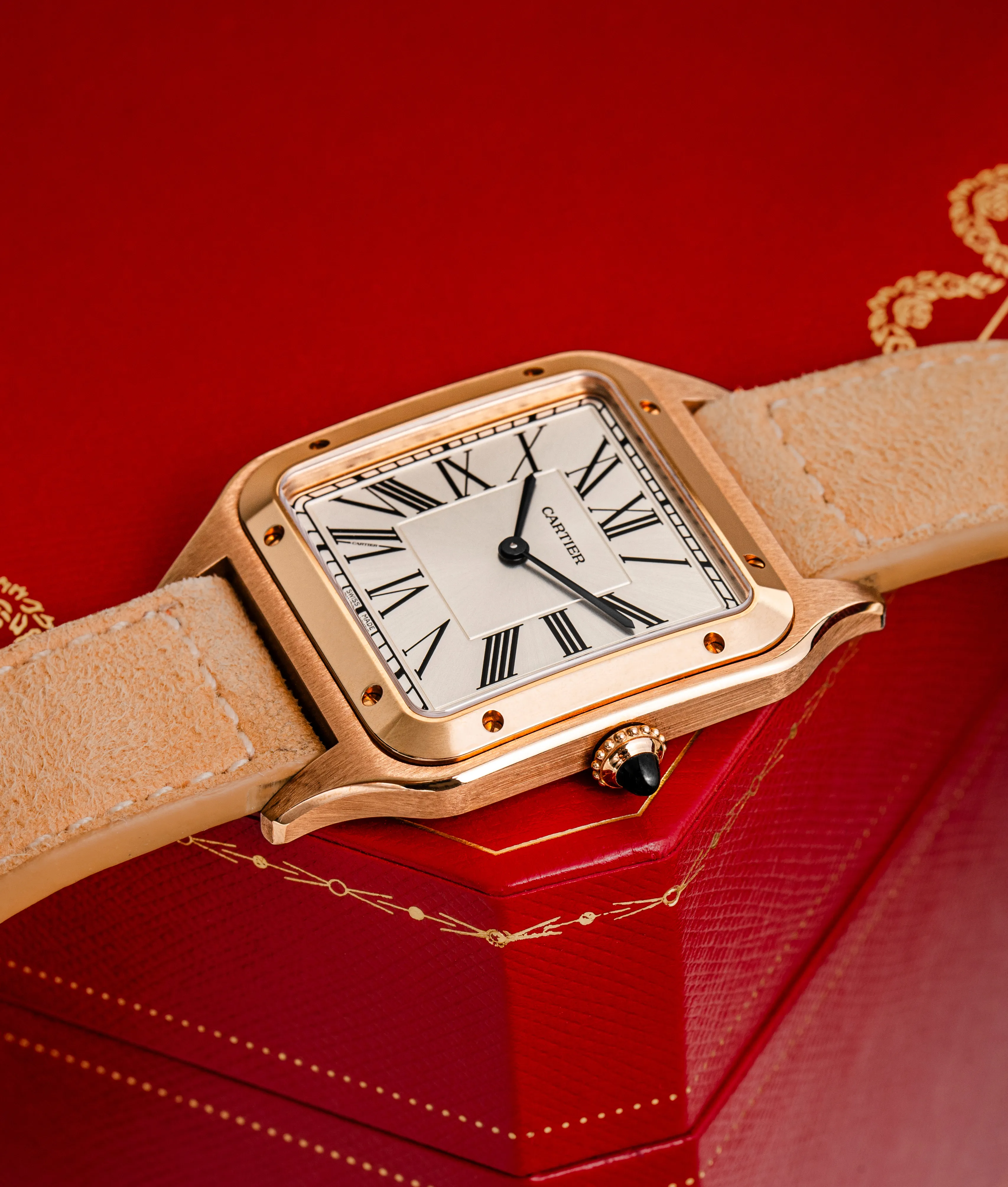 Cartier Tank angled view showing the white Roman numeral dial and rose gold case