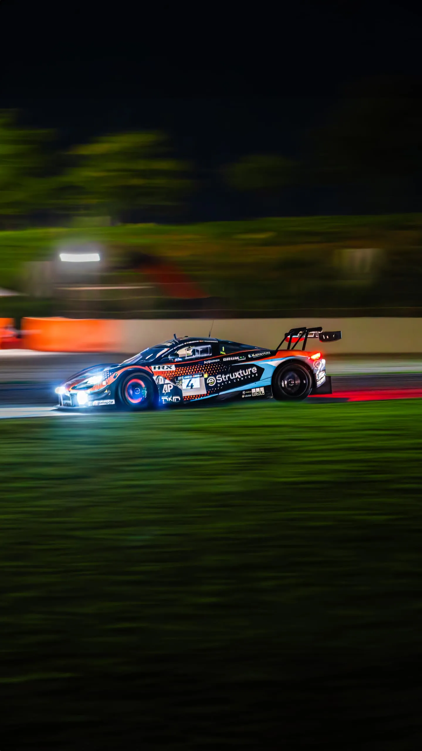 GT motorsport photography at night — by Andrea Corno